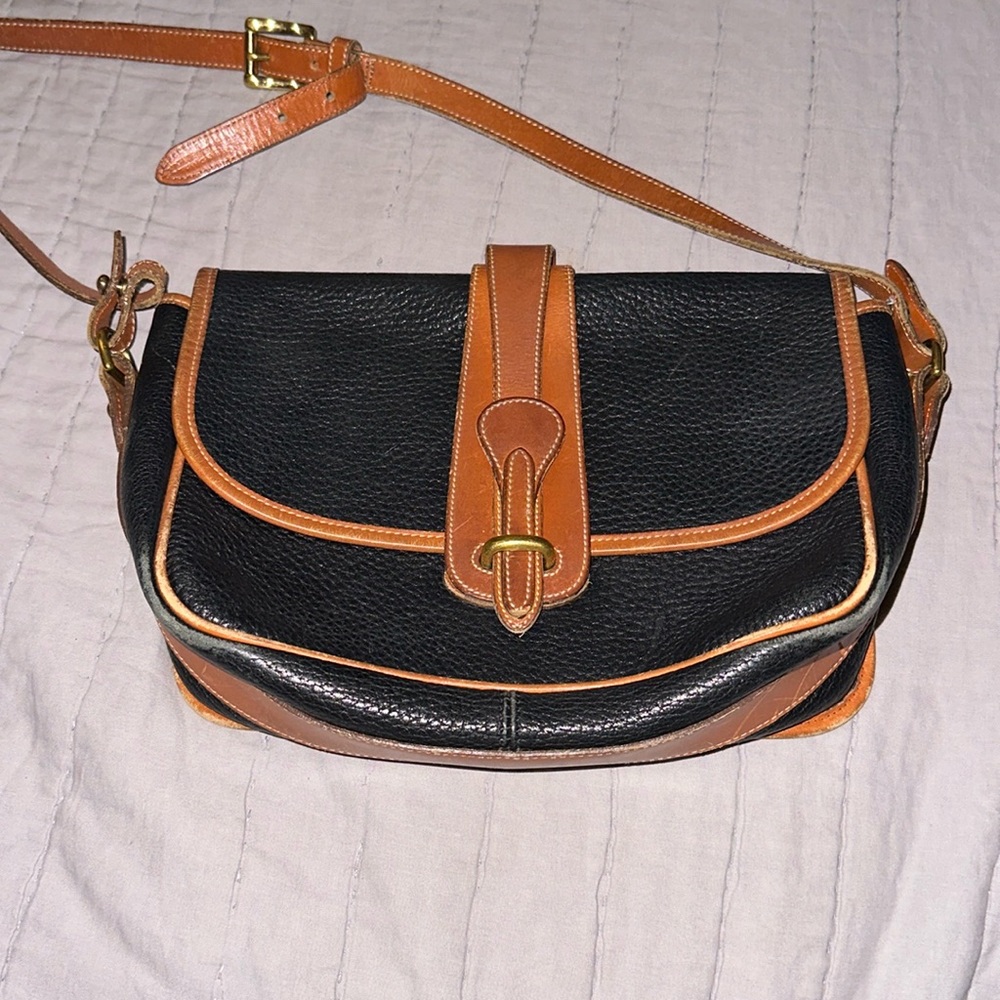 Vintage Dooney & Bourke crossbody bag with flap for closure black/navy tan